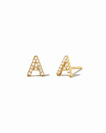 Tiny CZ studded gold initial earrings in the letter "A".