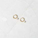Delicate and feminine gold pearl charm earrings. 