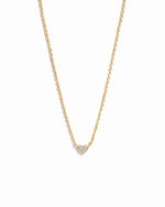 Delicate gold cz heart pendant necklace on a minimalist chain.