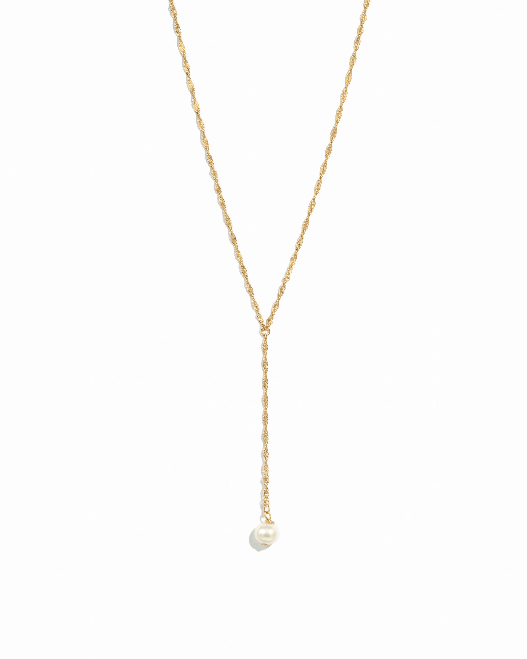 Gold pearl lariat necklace.
