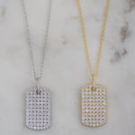 Studded pavé dog tag necklaces in silver and gold.