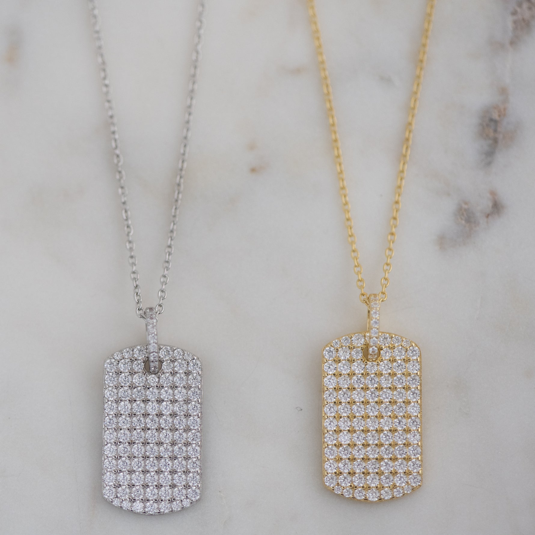 Studded pavé dog tag necklaces in silver and gold.