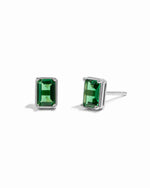 Sterling silver emerald-cut emerald gemstone stud earrings.