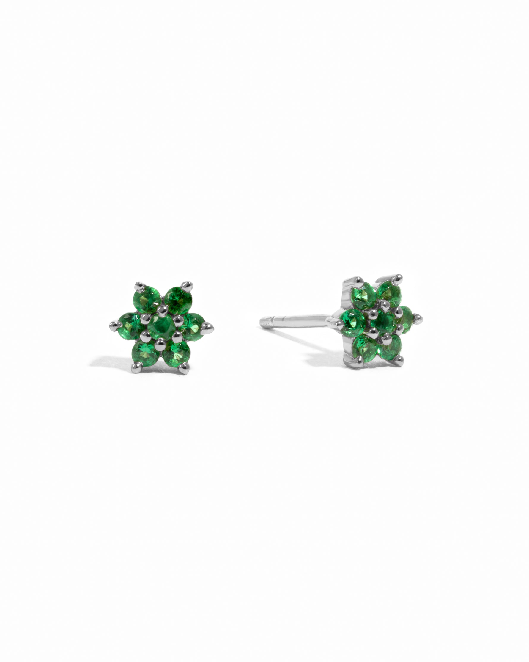 Sterling silver delicate emerald gemstone flower stud earrings.