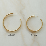 Statement gold tube hoops similar to the ones Madison Beer always wears. 