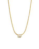 Gold baguette bezel diamond statement pendant necklace on white background