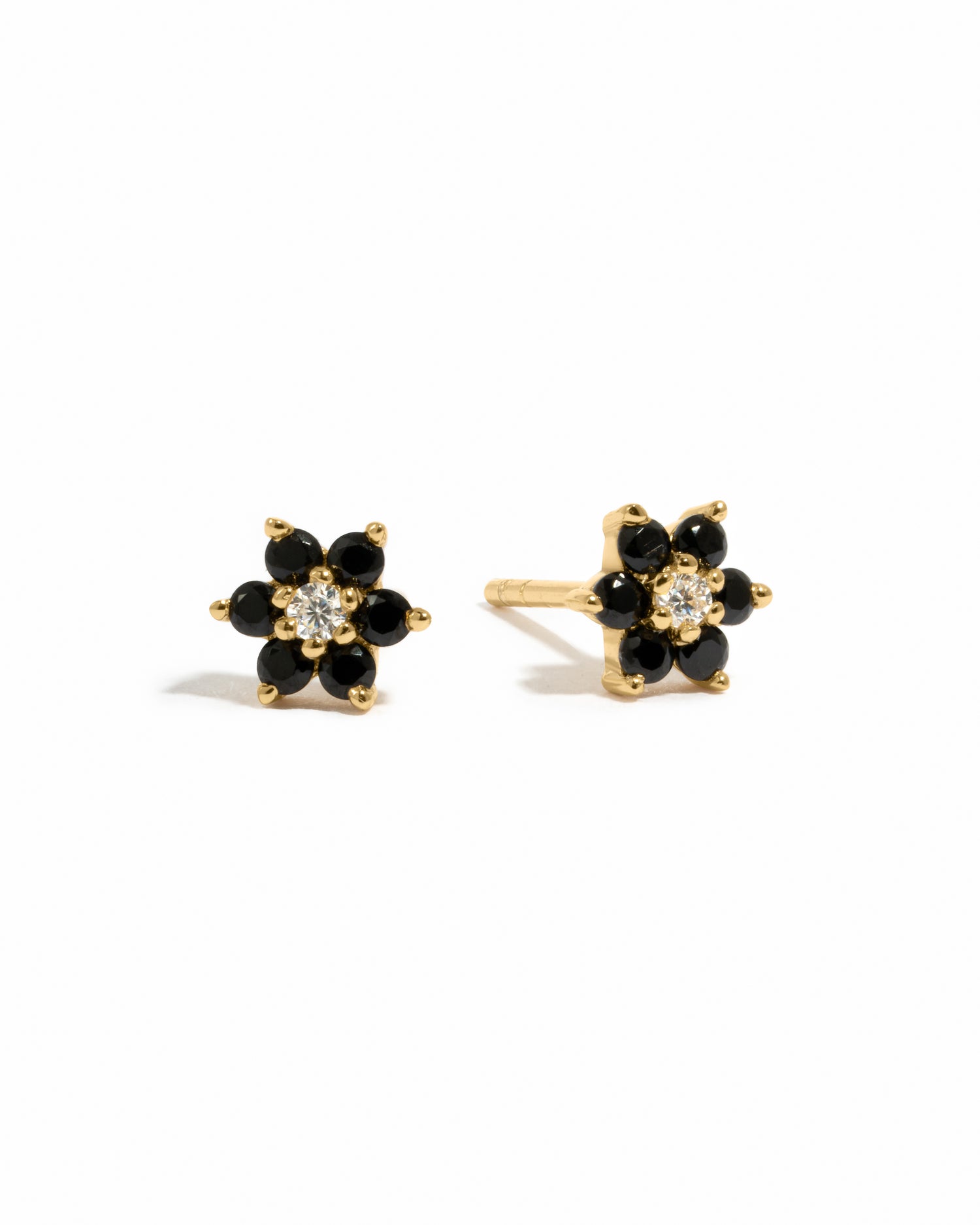 Gold black gemstone stud earrings with white cz diamond center.