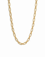 Gold statement chain link necklace on white background