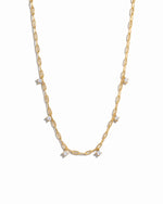 Dainty layering gold paperclip cz charm necklace on white background