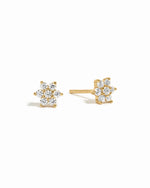 Gold dainty diamond cz flower stud earrings on white background.
