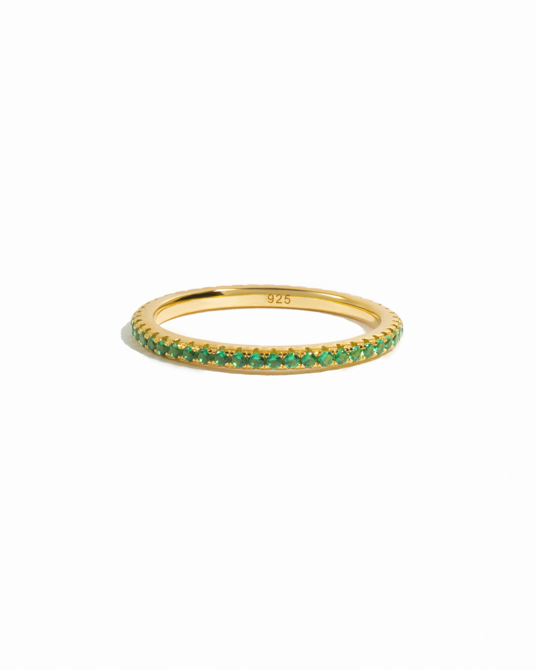 Gold Emerald Eternity Ring by Sami Jewels featuring a continuous row of vibrant emeralds set in a sleek gold band.