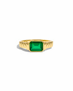 Statement gold ring with emerald gemstone. 