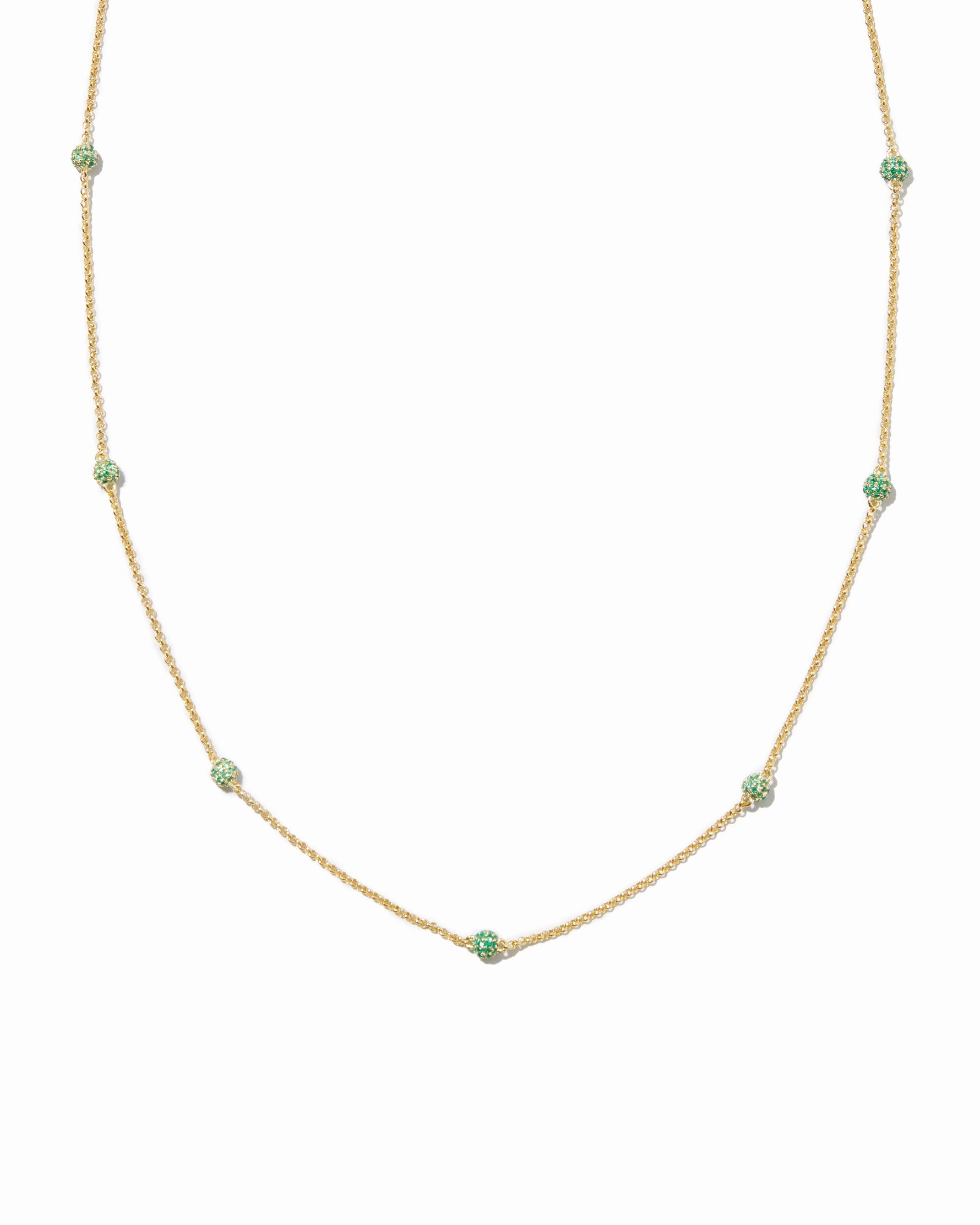 Emerald pavé beaded necklace on white background. 