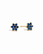 Solid sapphire gemstone flower stud earrings in gold.