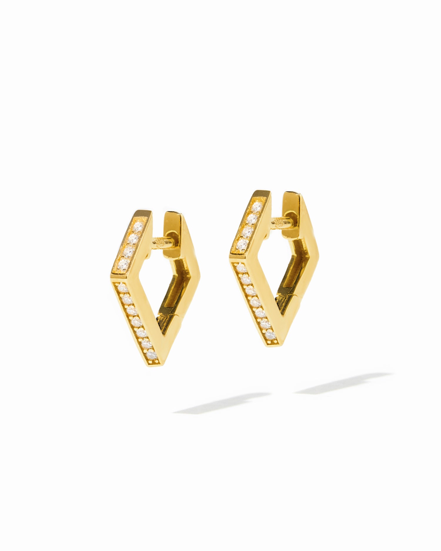 Gold geometric studded hoop earrings.