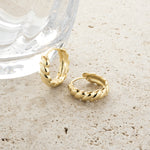 Unique round croissant hoop earrings in gold. 