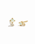 Dainty opal and cz stone stud earrings on white background.