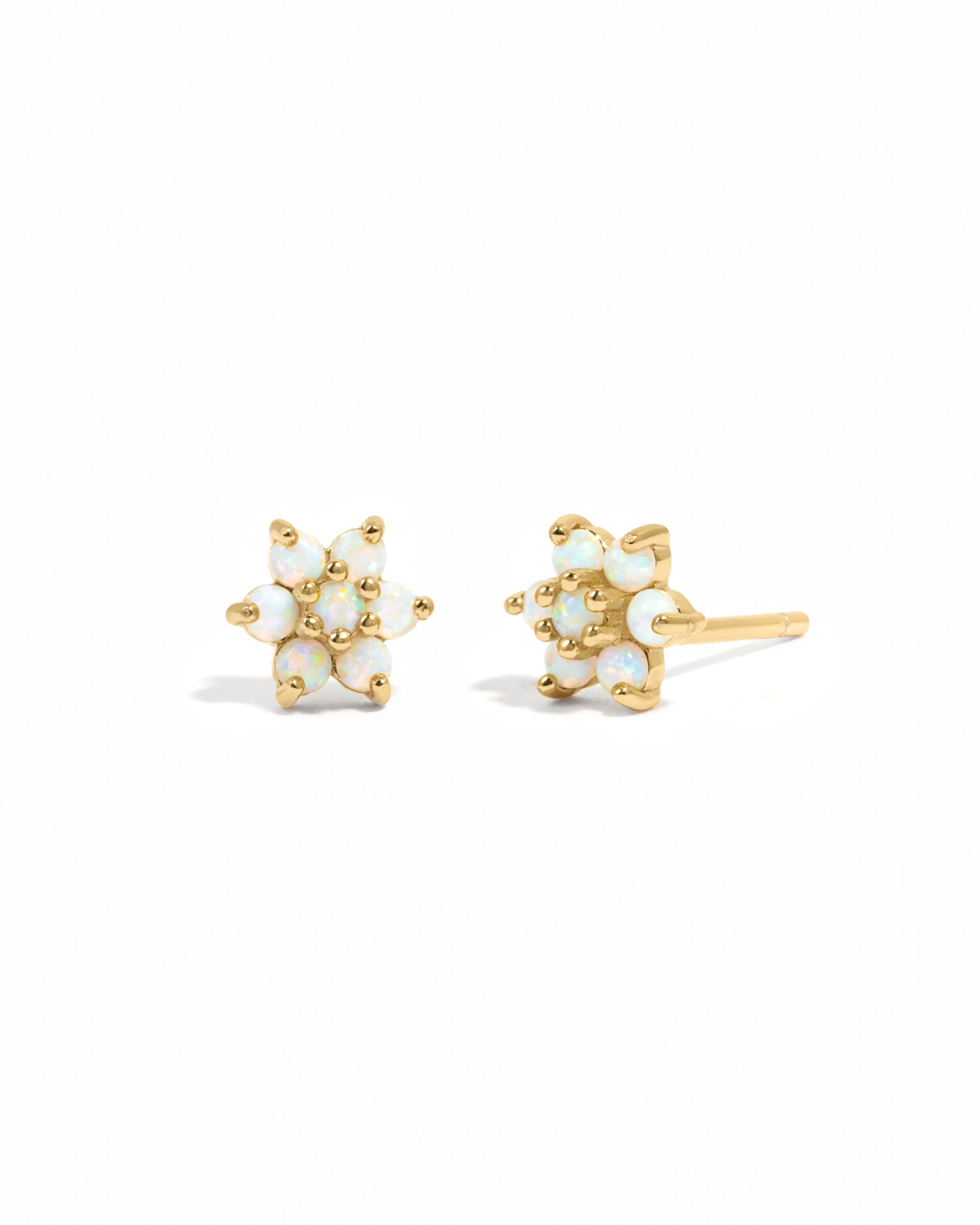 Delicate gold opal gemstone flower stud earrings.