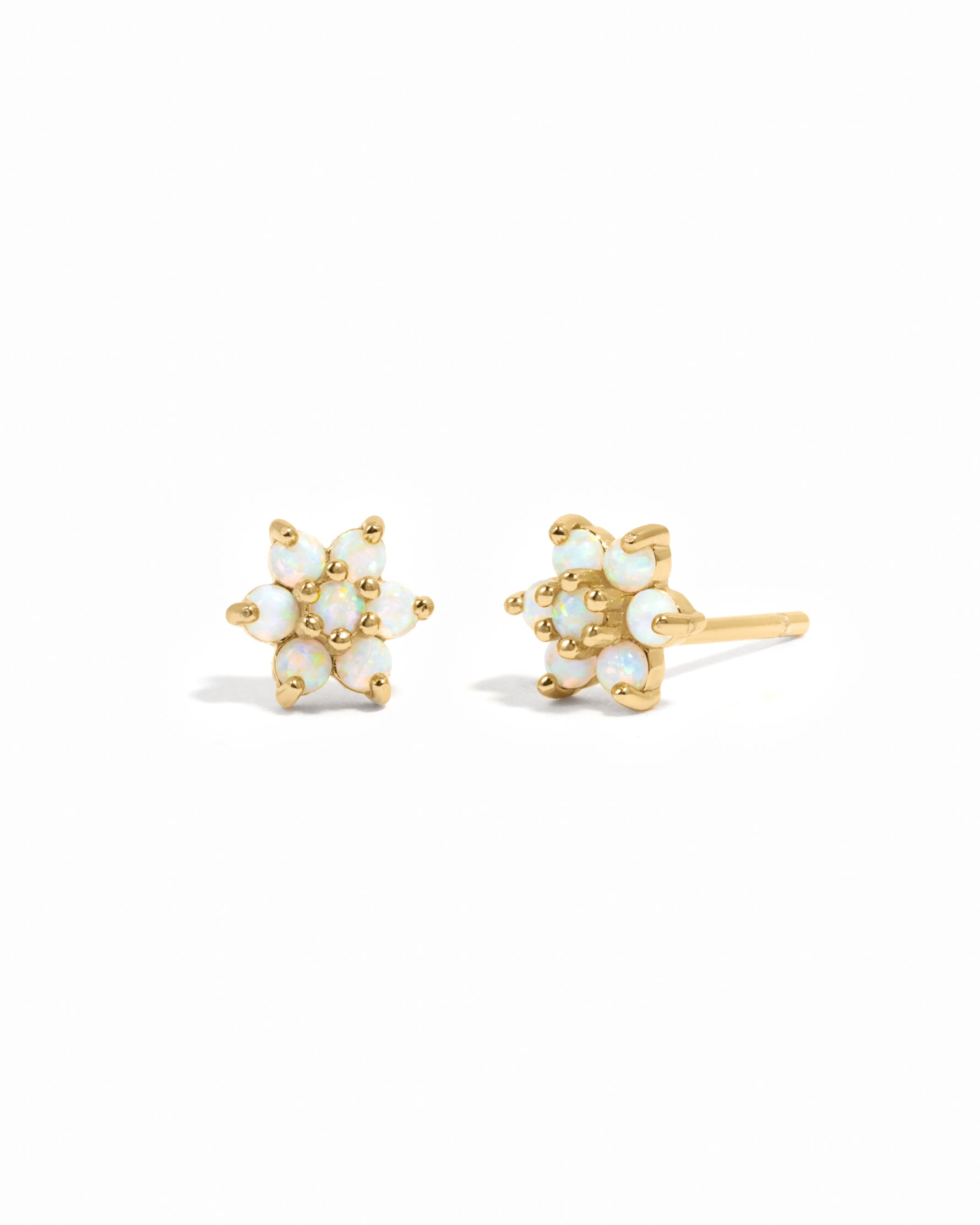 Delicate gold opal gemstone flower stud earrings.