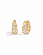 closeup view of small gold hoop earrings