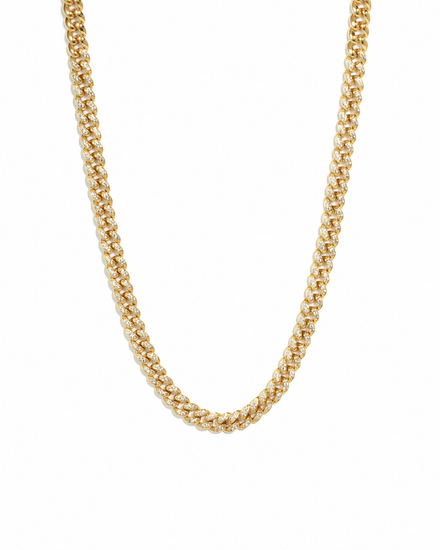 Gold curb chain link necklace on white background.