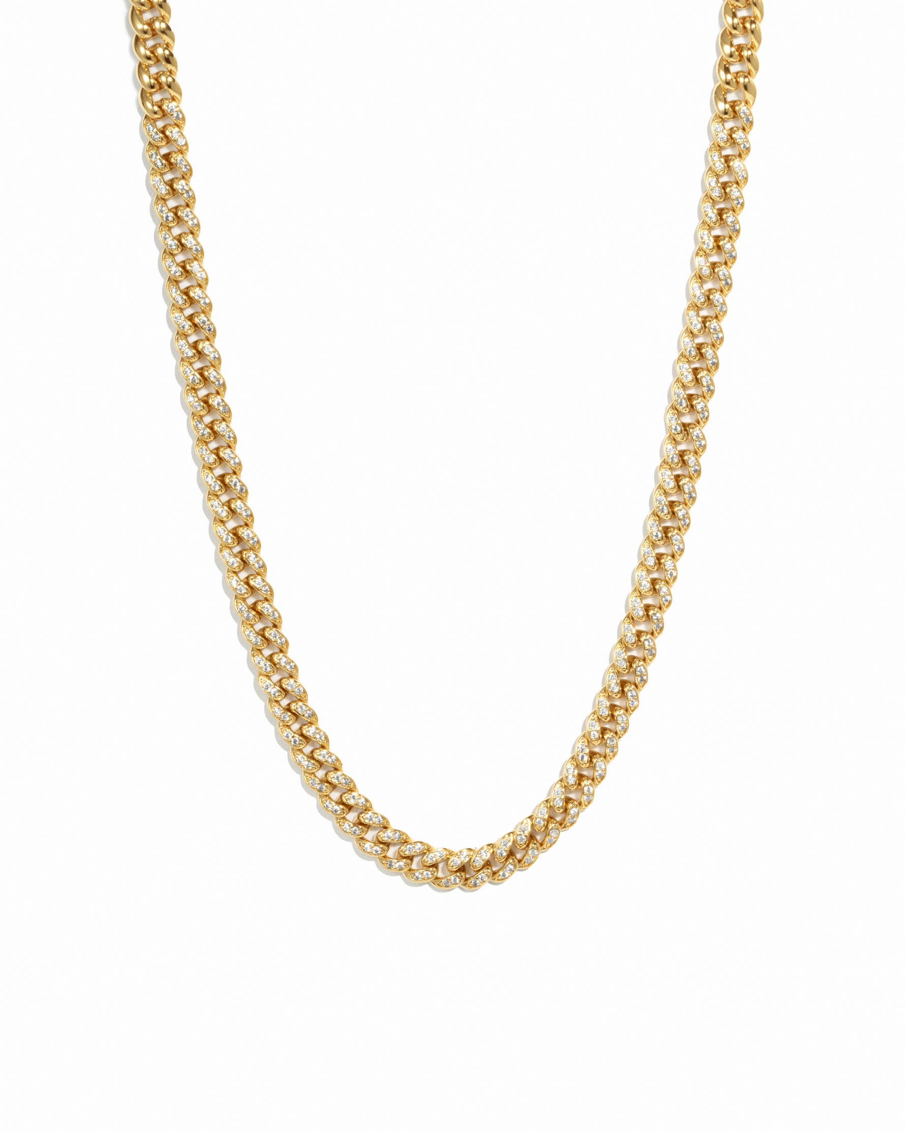 Gold curb chain link necklace on white background.