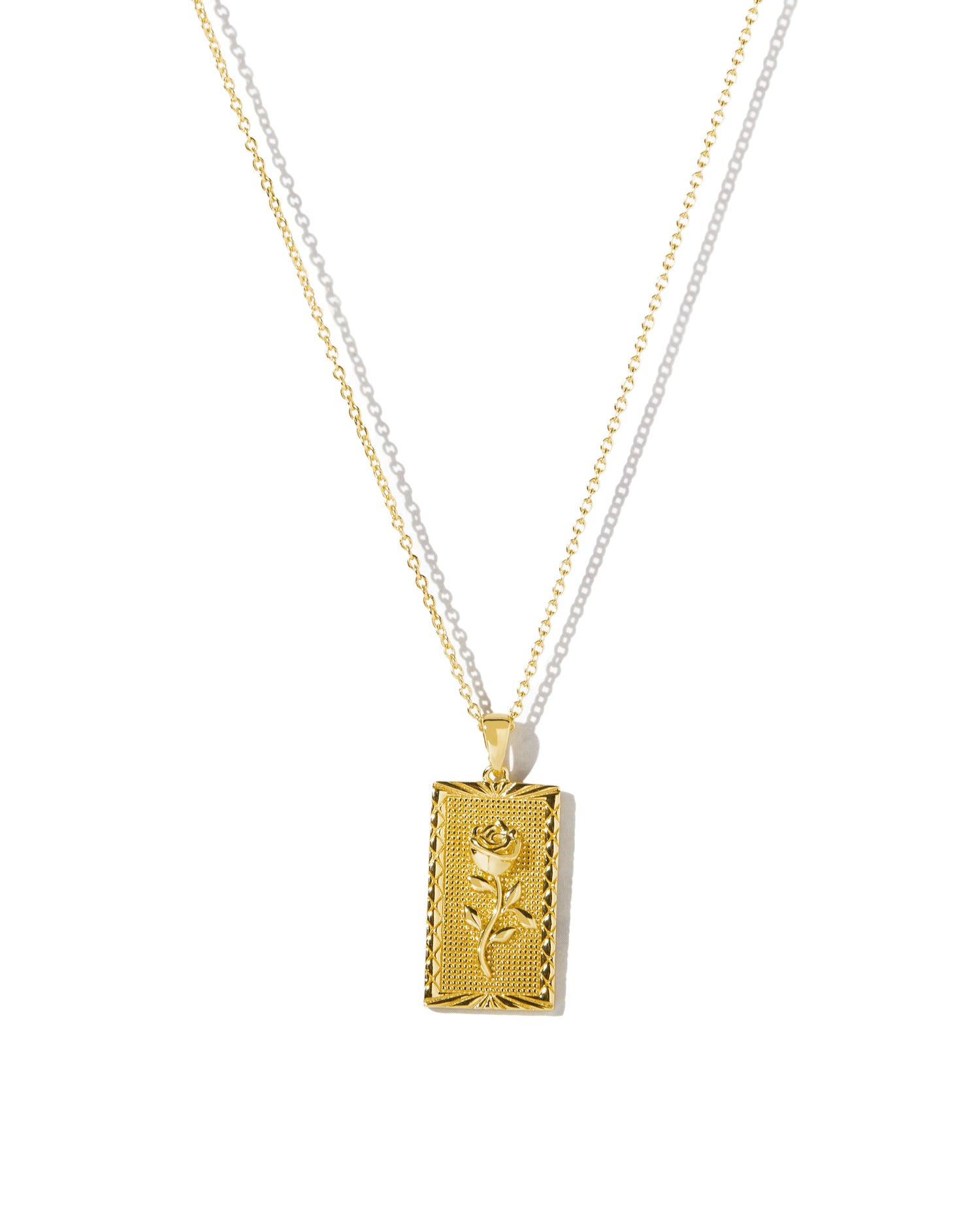 Rectangle rose medallion pendant necklace on white background.