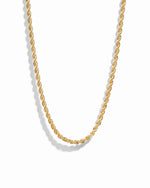 Gold rope chain necklace on white background.