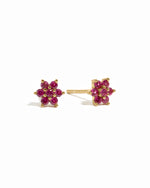Dainty gold ruby flower stud earrings.