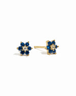 Gold sapphire flower stud earrings with white cz center stone.