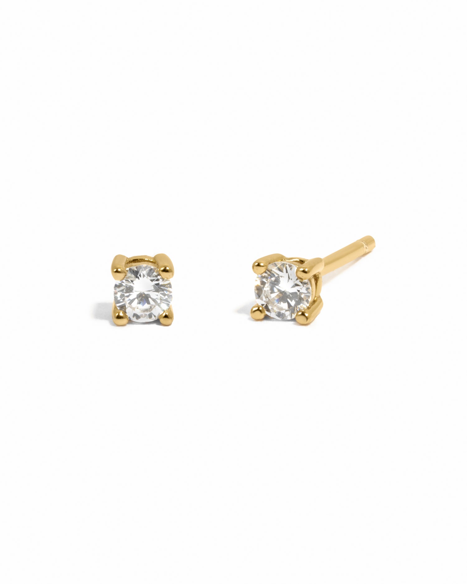Classic diamond stud earrings with gold post. 