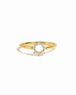 Gold sunburst cz dainty ring on white background. 