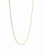 Delicate gold box chain necklace.