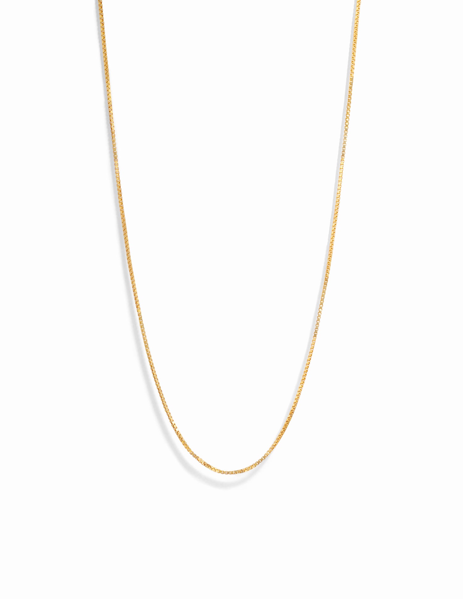 Delicate gold box chain necklace.