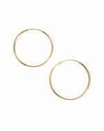 Skinny Hoop earrings in gold