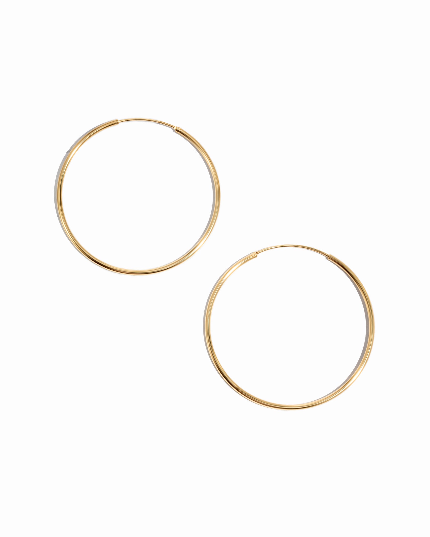Skinny Hoop earrings in gold