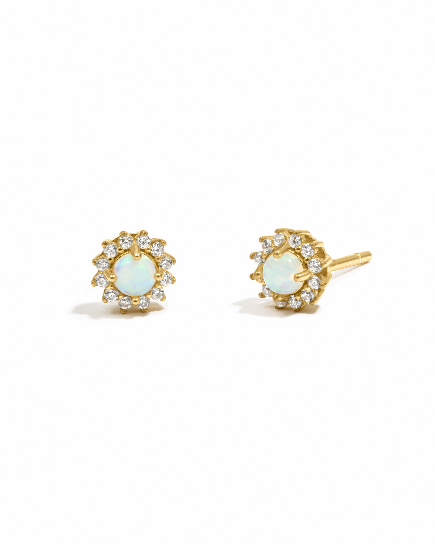 Minimalist tiny gold opal sunburst stud earrings in gold.