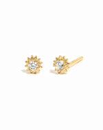 Dainty gold sunburst stud earrings with cz center.