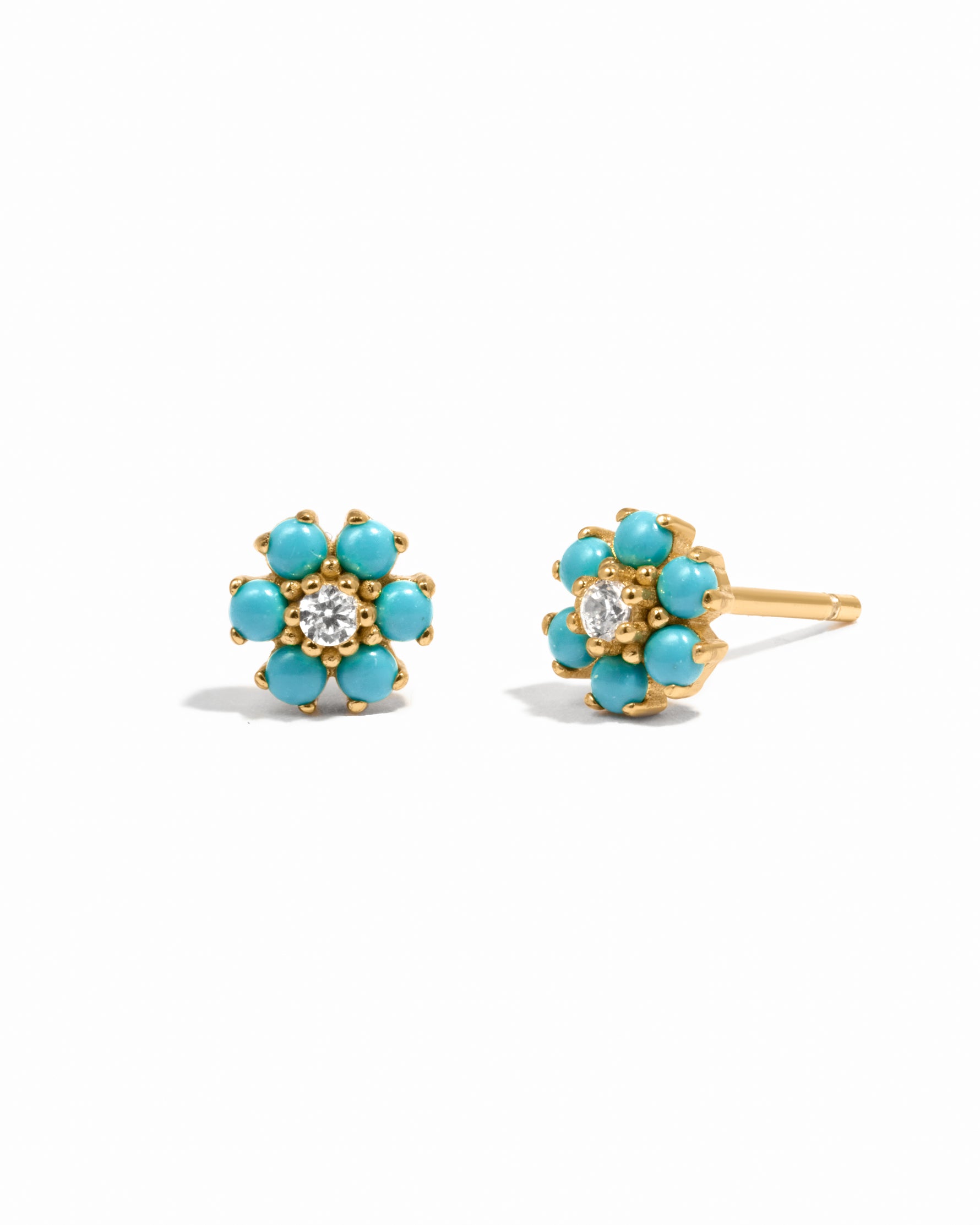 Gold turquoise flower stud earrings with cz stone center. 