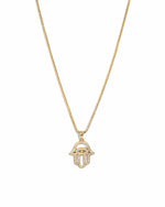 Hamsa gold cz pendant necklace on white background.