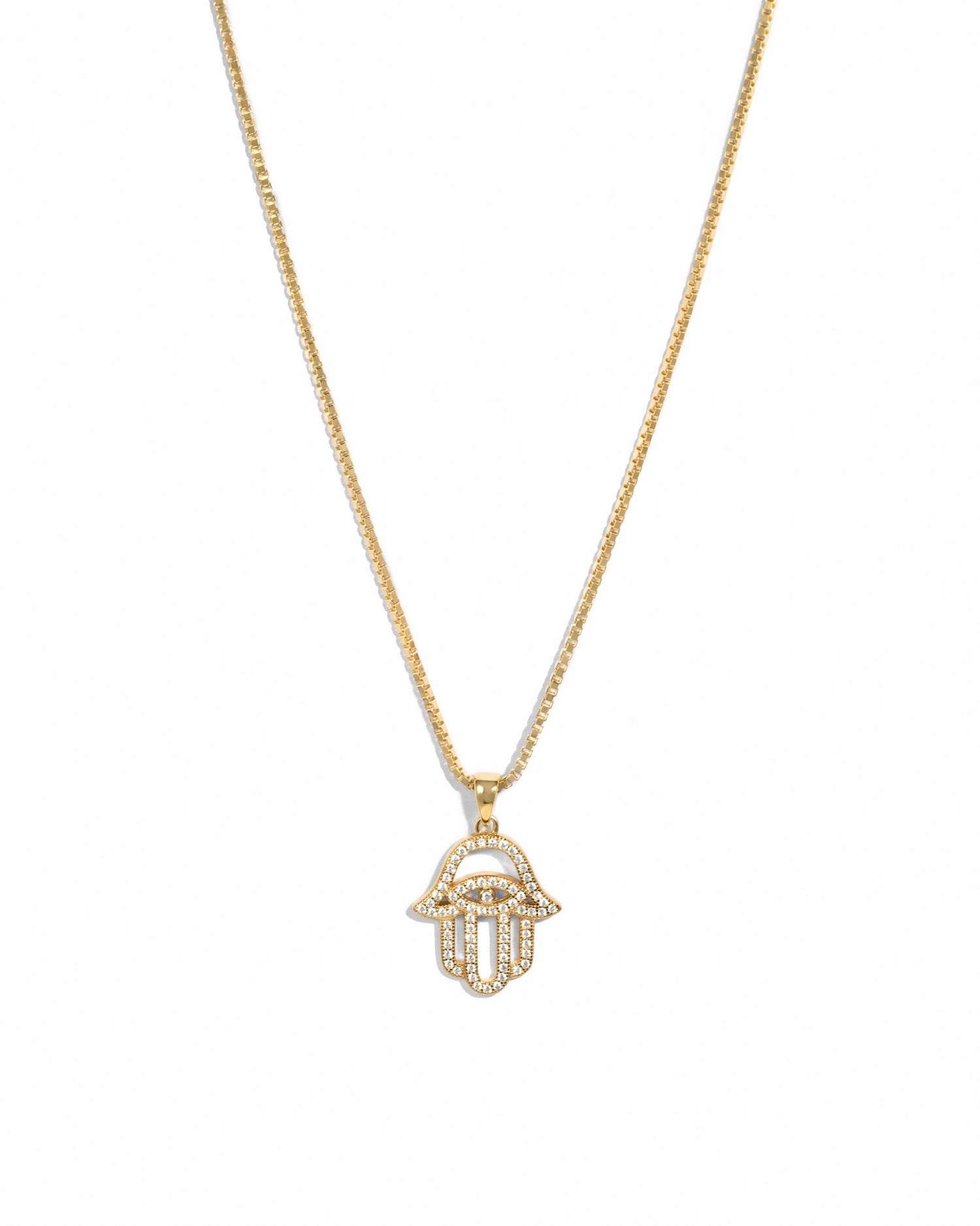 Hamsa gold cz pendant necklace on white background.