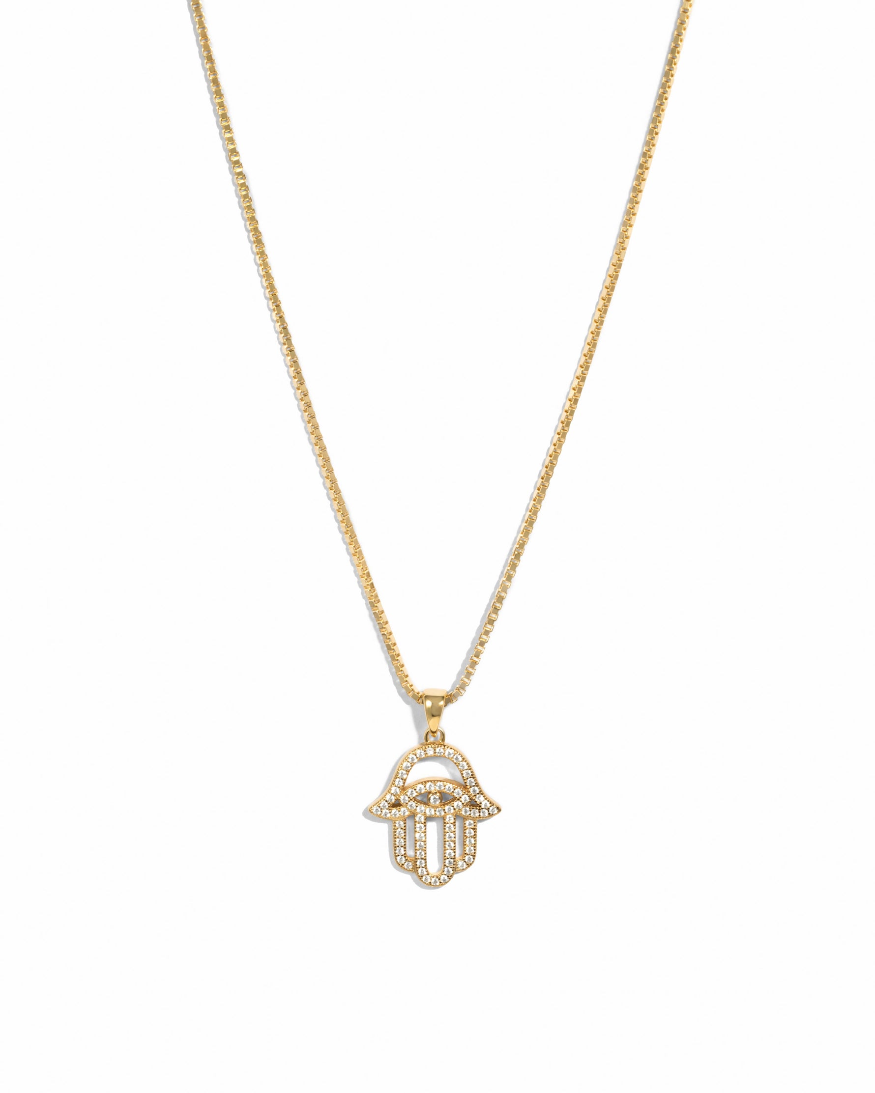 Hamsa gold cz pendant necklace on white background.