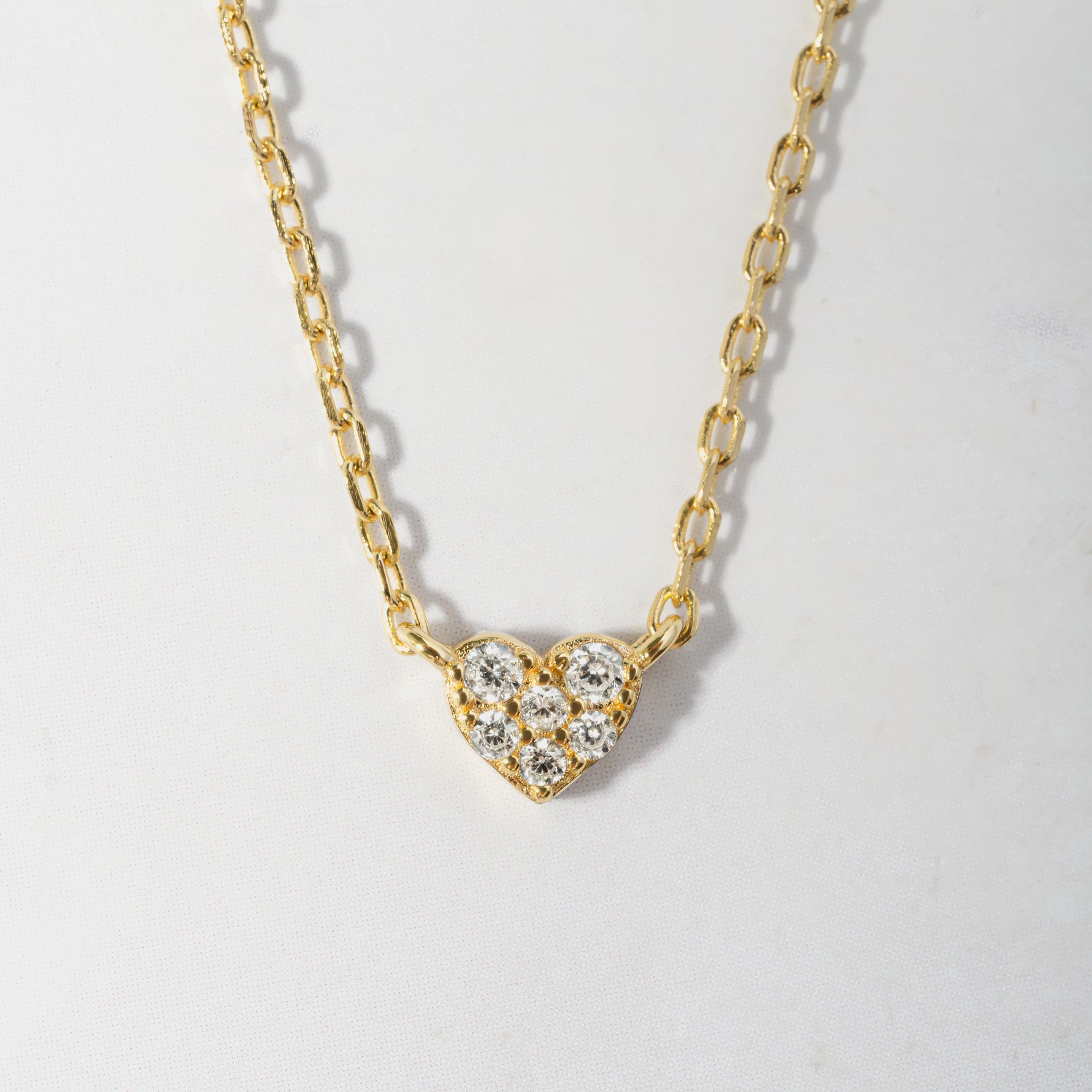 close-up of cz tiny heart necklace pendant.