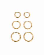Gold small, medium, and big minimalist hoop earrings in a set