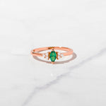 Rosegold emerald marquise shaped birthstone ring.