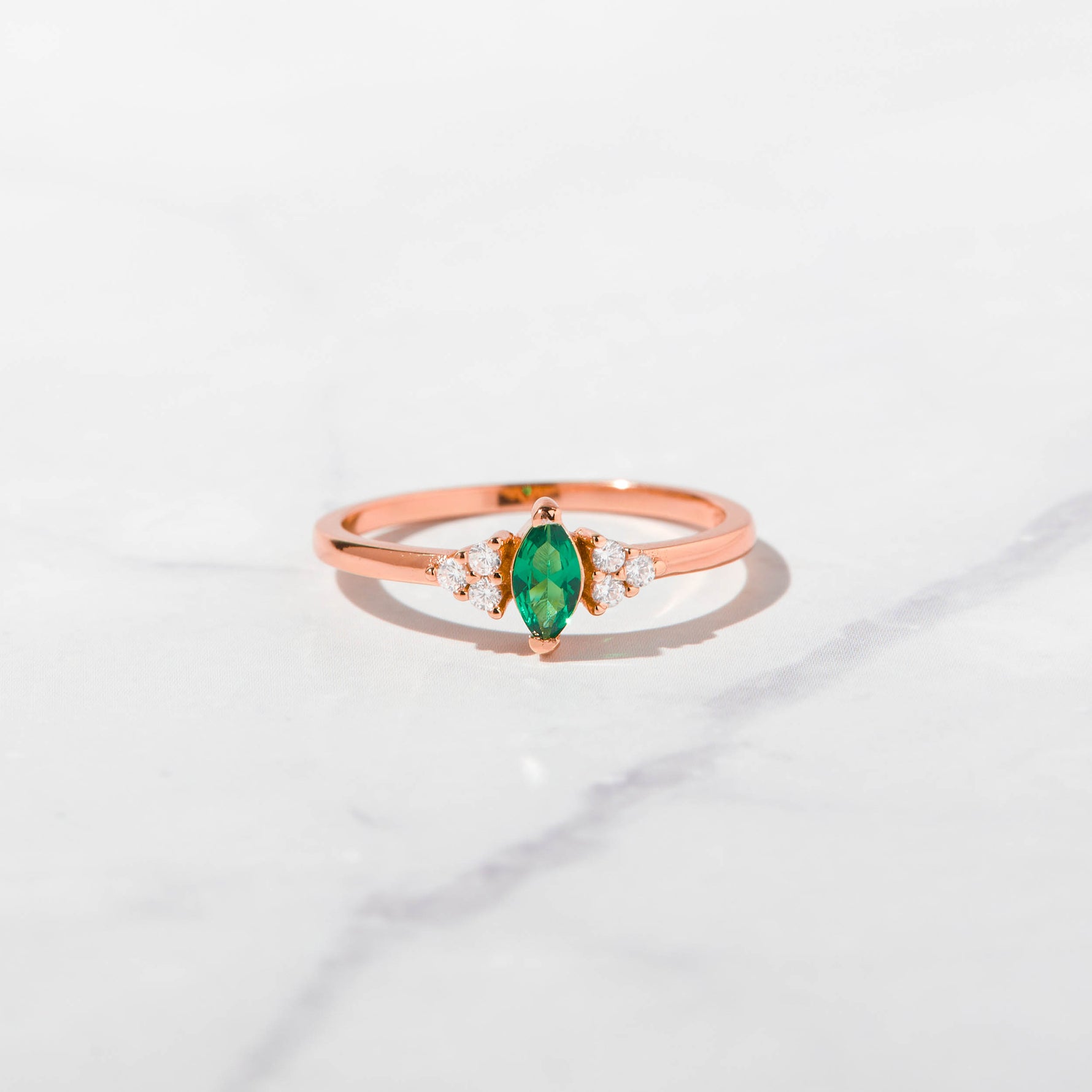 Rosegold emerald marquise shaped birthstone ring.
