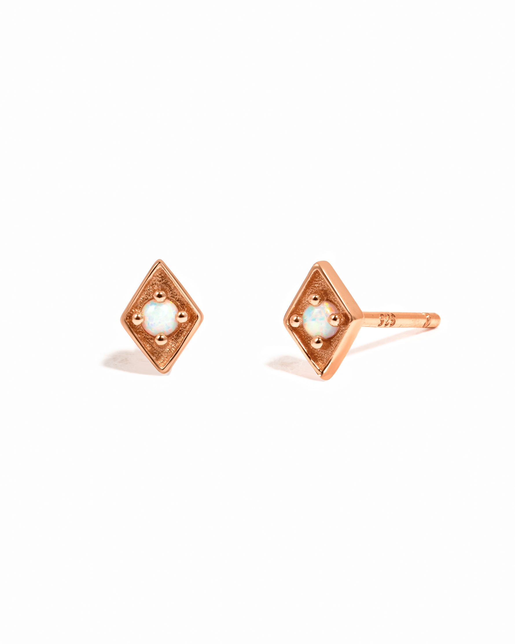 Rose gold diamond shaped opal stud earrings. 