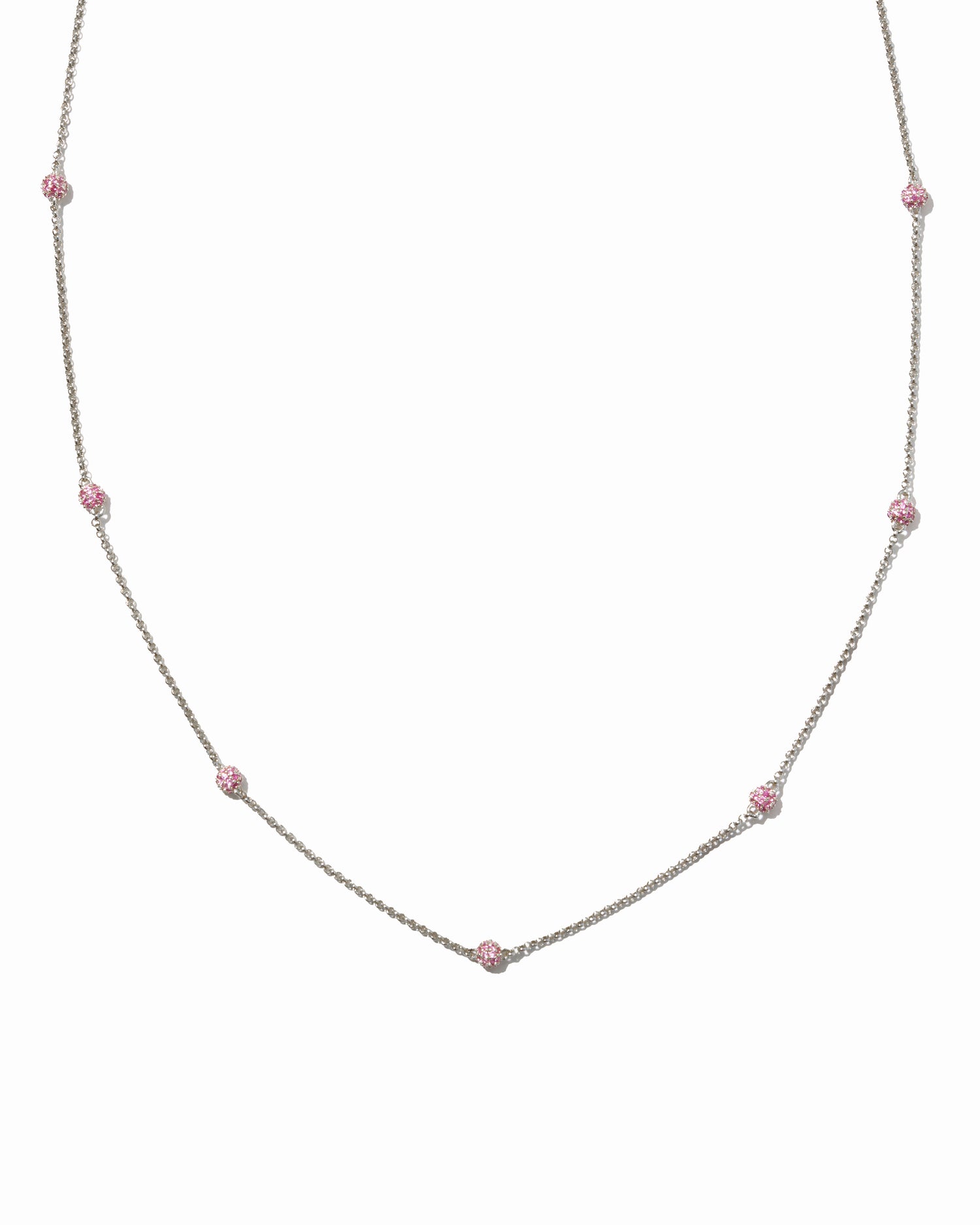 Silver pavé ruby beaded ball necklace on white background