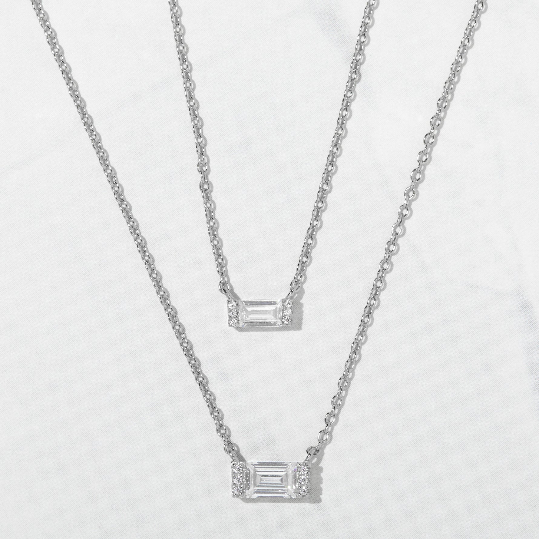 Silver minimalist baguette necklaces in a small and medium size. 