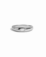 Sterling silver oval cz bezeled dome ring on white background.